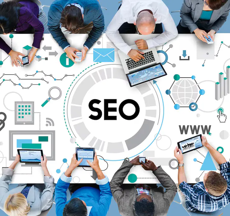 Team analyzing SEO strategies on digital devices to enhance digital marketing services.